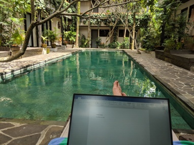 Writing by the pool in Bali